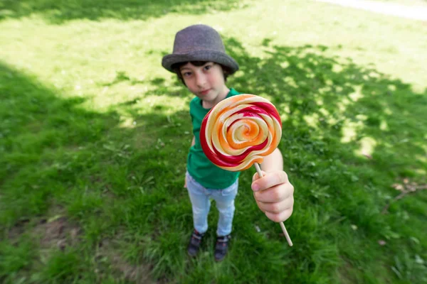 Joyful Boy Holding Lollipop His Hands Wide Angle Lens Distortion — Stock Photo, Image