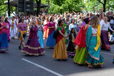 BERLIN - JUNE 09, 2019: The annual Carnival of Cultures (Karneval der Kulturen) celebrated around the Pentecost weekend. Participants carnival on the street. clipart