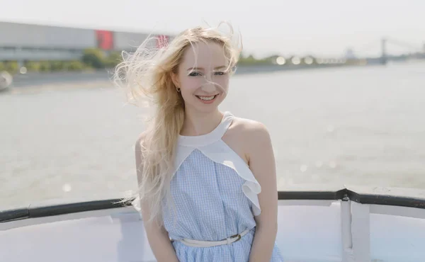 Young woman enjoy a boat tour through river.