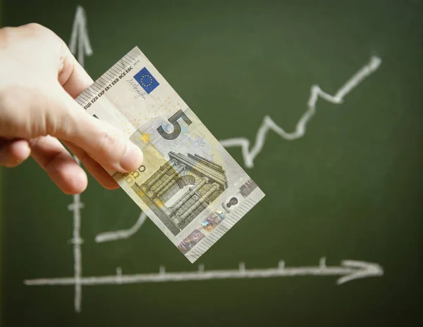 Chart with positive arrow and euro banknote.