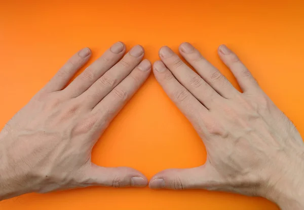 Signo Mano Triángulo Sobre Fondo Naranja — Foto de Stock