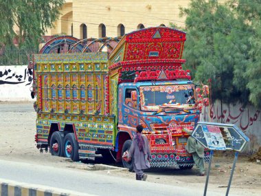 Truck art is a popular form of regional decoration in South Asia, with Pakistani and Indian trucks featuring elaborate floral patterns and calligraphy. clipart