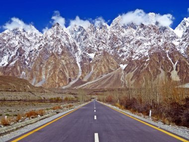 The Passu Cones, also known as Cathedral Ridge, as viewed from the Karakoram Highway in Passu. Foreground: Hunza river. clipart