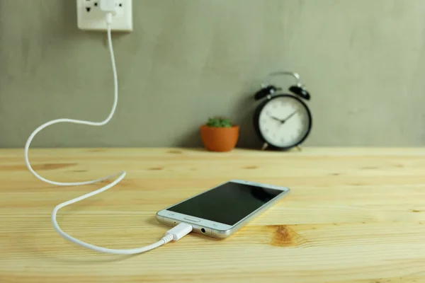 Plug Power Outlet Adapter Cord Charger Mobile Phone Wooden Floor — Stock Photo, Image