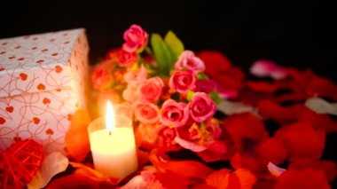 Footage of gift boxes, candle burning and flower for Valentine day collection