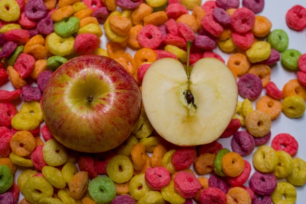 WHOLE APPLE AND HALF APPLE ON CEREAL — Stock Photo, Image