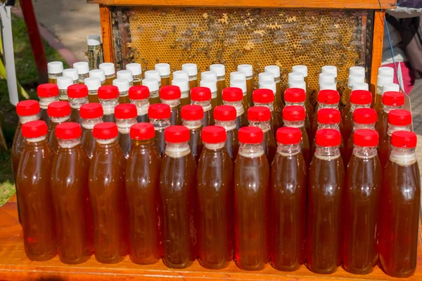 BOTTLES WITH NATURAL PURE HONEY