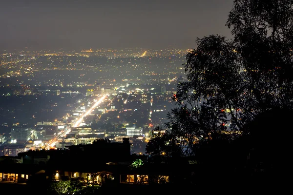 hollywood hills and valley at night near hollywood sign