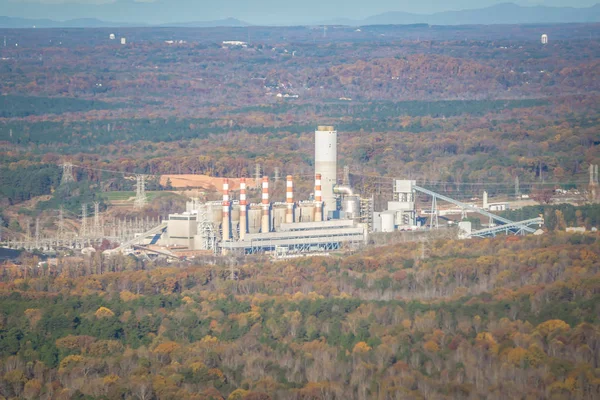 aerial from an airplane over hydro power energy plant and dam