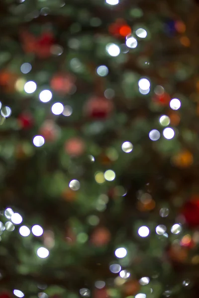 defocused christmas tree lit up for the holidays