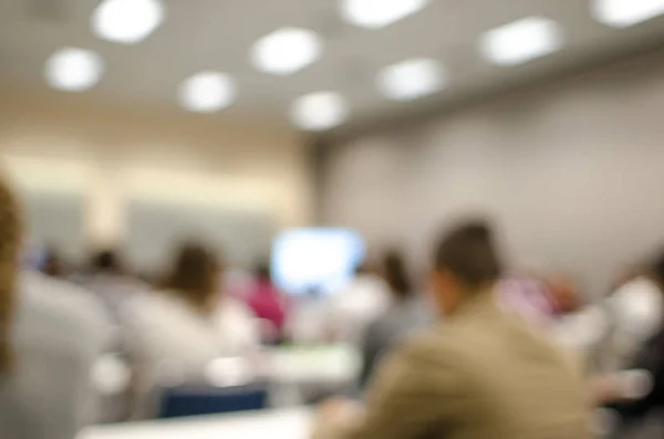 Abstract defocused view in class room with students — Stock Photo, Image