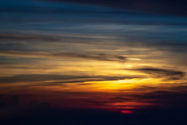 Sun setting over clouds views from airplane — Stock Photo, Image