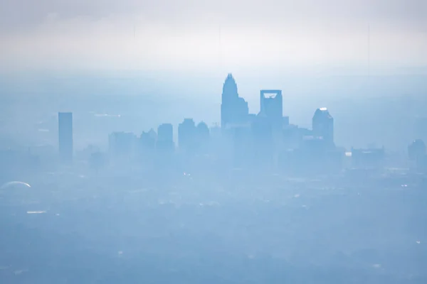 Sun rising early morning over charlotte skyline  seen from airplane