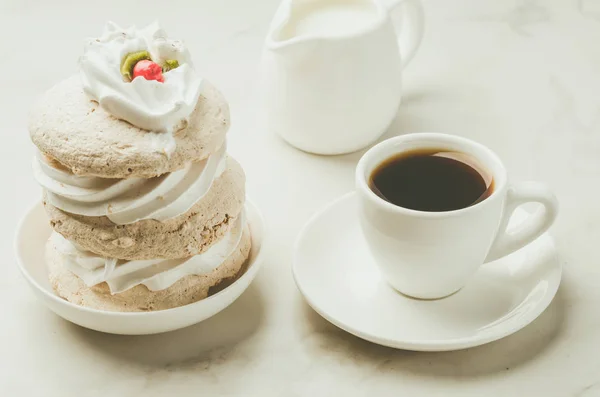 Espresso white cup with dessert and milk/Espresso white cup with dessert and milk on white marble background