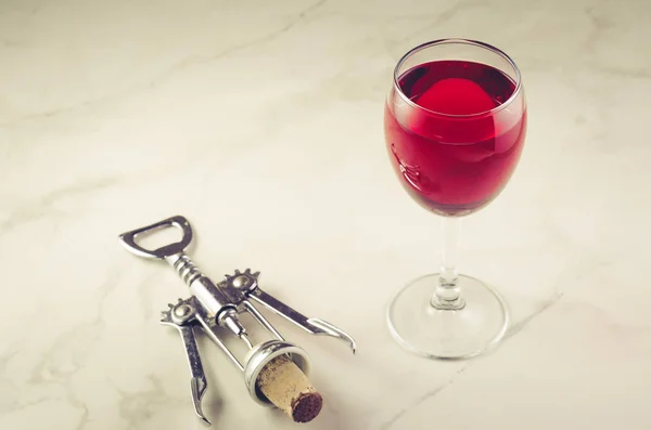 Food background with Wine and corkscrew/Food background with two red Wine and corkscrew.