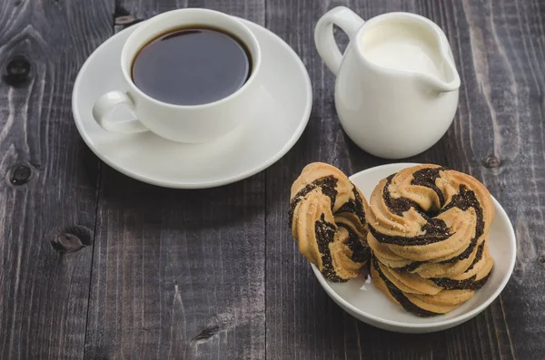 cookies, coffee and creamer     cookies, coffee and creamer on a wooden table
