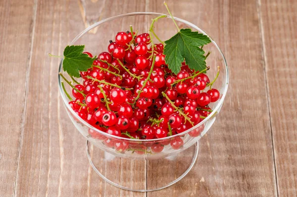 glass bowl full of red currant/glass bowl full of red currant. Top view