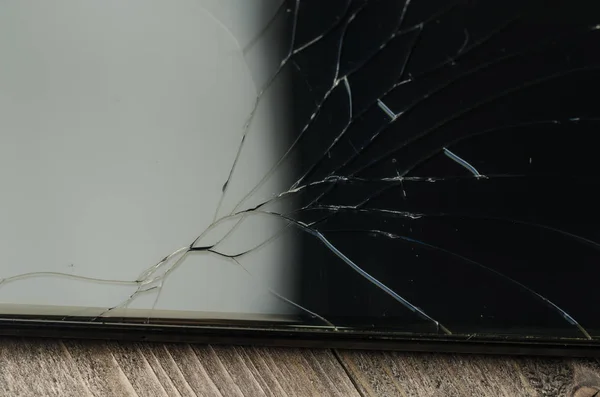 broken glass on the black smartphone/broken glass on the black smartphone. Top view