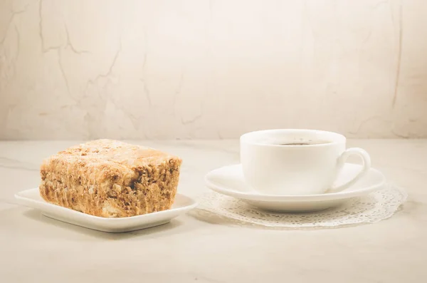 coffee break with a dessert/coffee cup and dessert on a white background. Selective focus