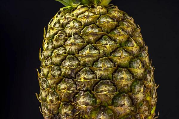 Close Shot Ripe Yellow Pineapple Textured Peel Green Leaves Black — Stock Photo, Image