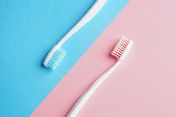 Toothbrushes on color table — Stock Photo, Image