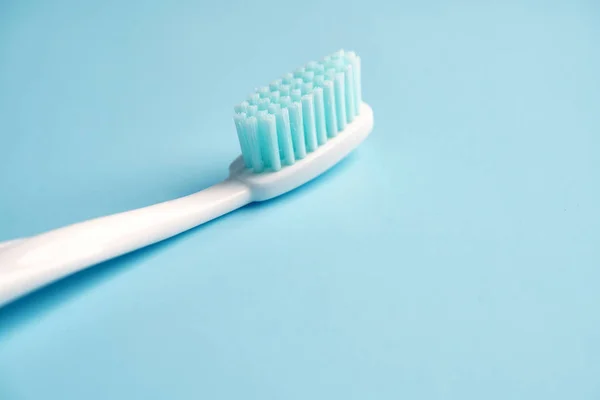 Toothbrushes on color table — Stock Photo, Image