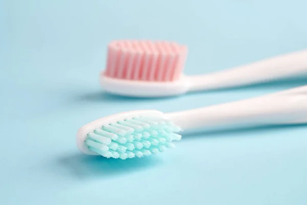 Toothbrushes on color table — Stock Photo, Image