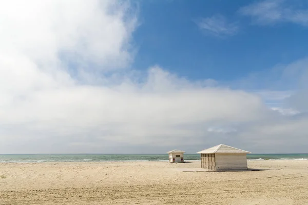 Empty sandy beach with closed bars