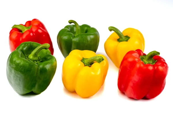 Red, yellow, green paprika (pepper) isolated on a white background