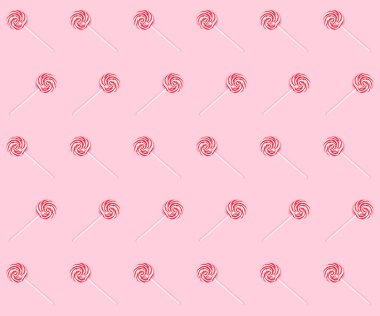 Pembe bir arka plan üzerinde çizgili tatlı lolipop ile sorunsuz partern