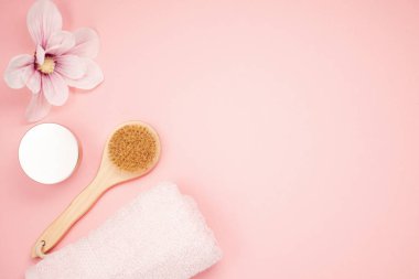 Feminine beauty and spa products, tools and cosmetics over the millennial pink background clipart