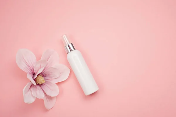 Feminine beauty and spa product and cosmetics over the millennial pink background