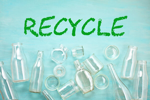 Wastes of different glass containers ready for recycling. Social responsibility, ecology care concept