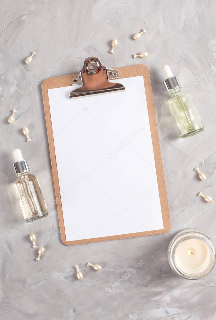 Various spa related objects on gray background, top view. Body and skin care flat lay with copy space. Beauty care concept