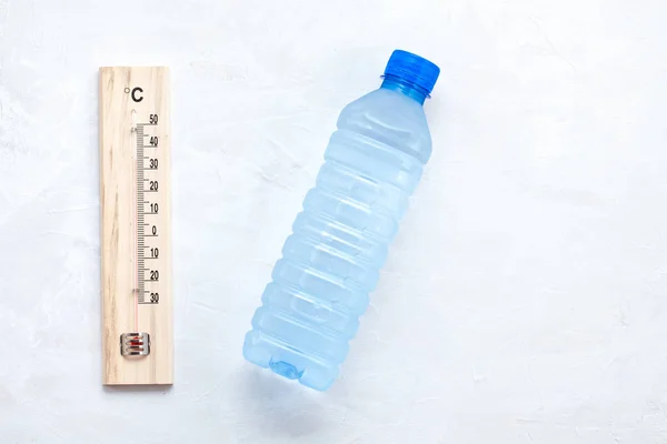 Essential rule for summer heat: to drink a lot of water to avoid dehydration. Flat lay, top view