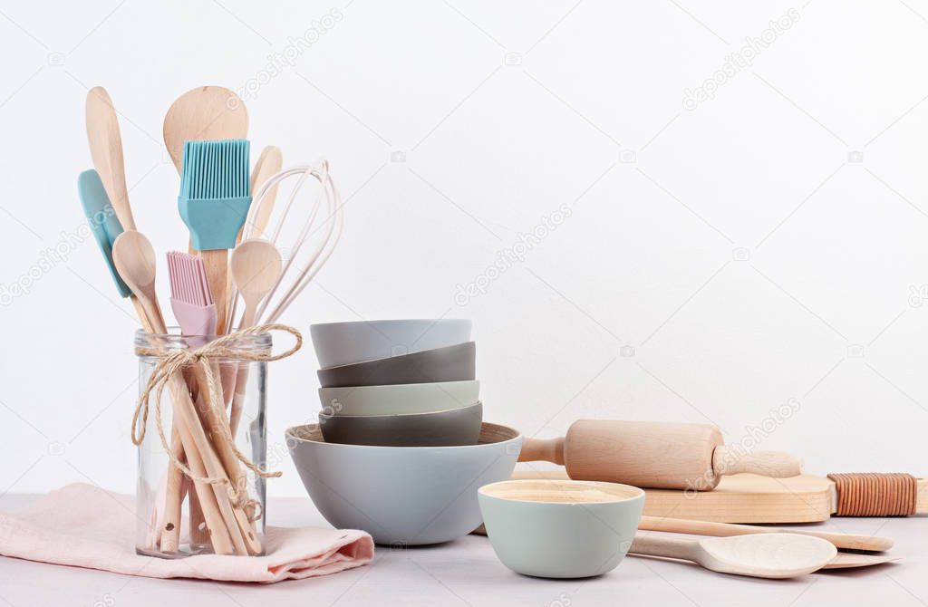 Various kitchen utensils on light background