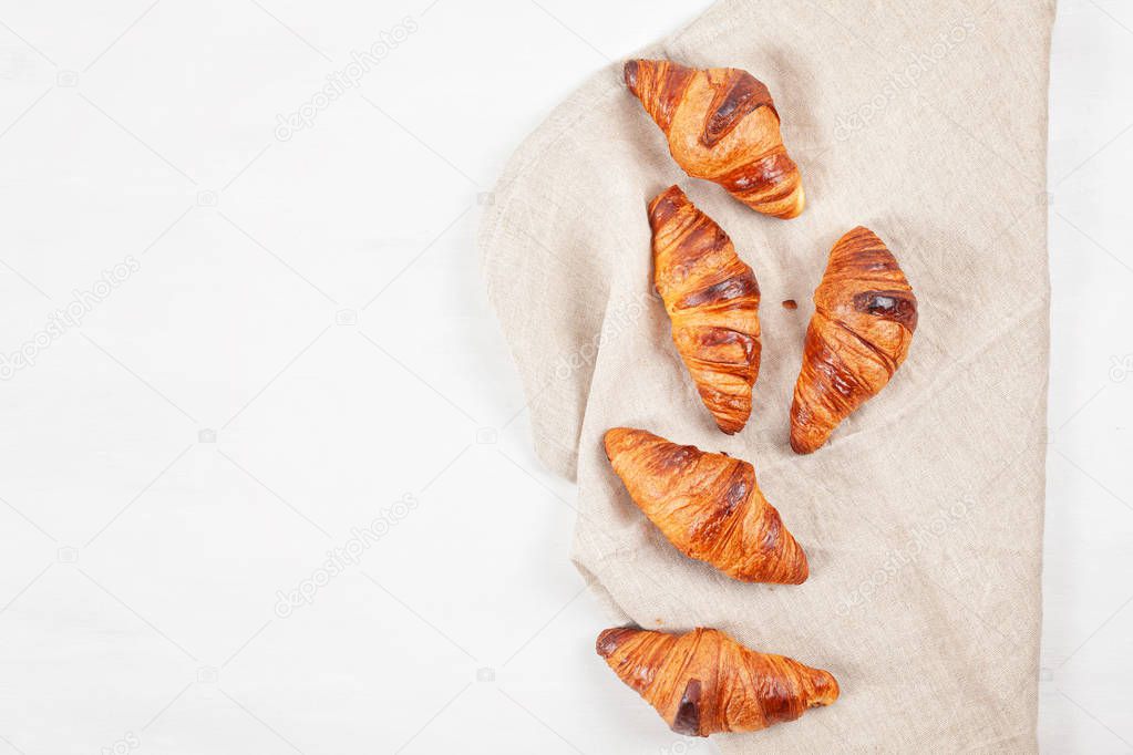 Top view over freshly baked croissants ready for breakfast