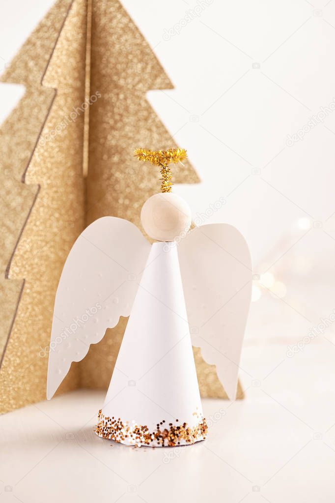 Christmas greeting card mock up with paper angel and christmas tree and decoration.