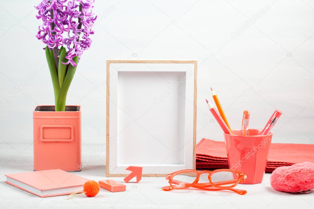 Poster frame with decor elements in living coral color
