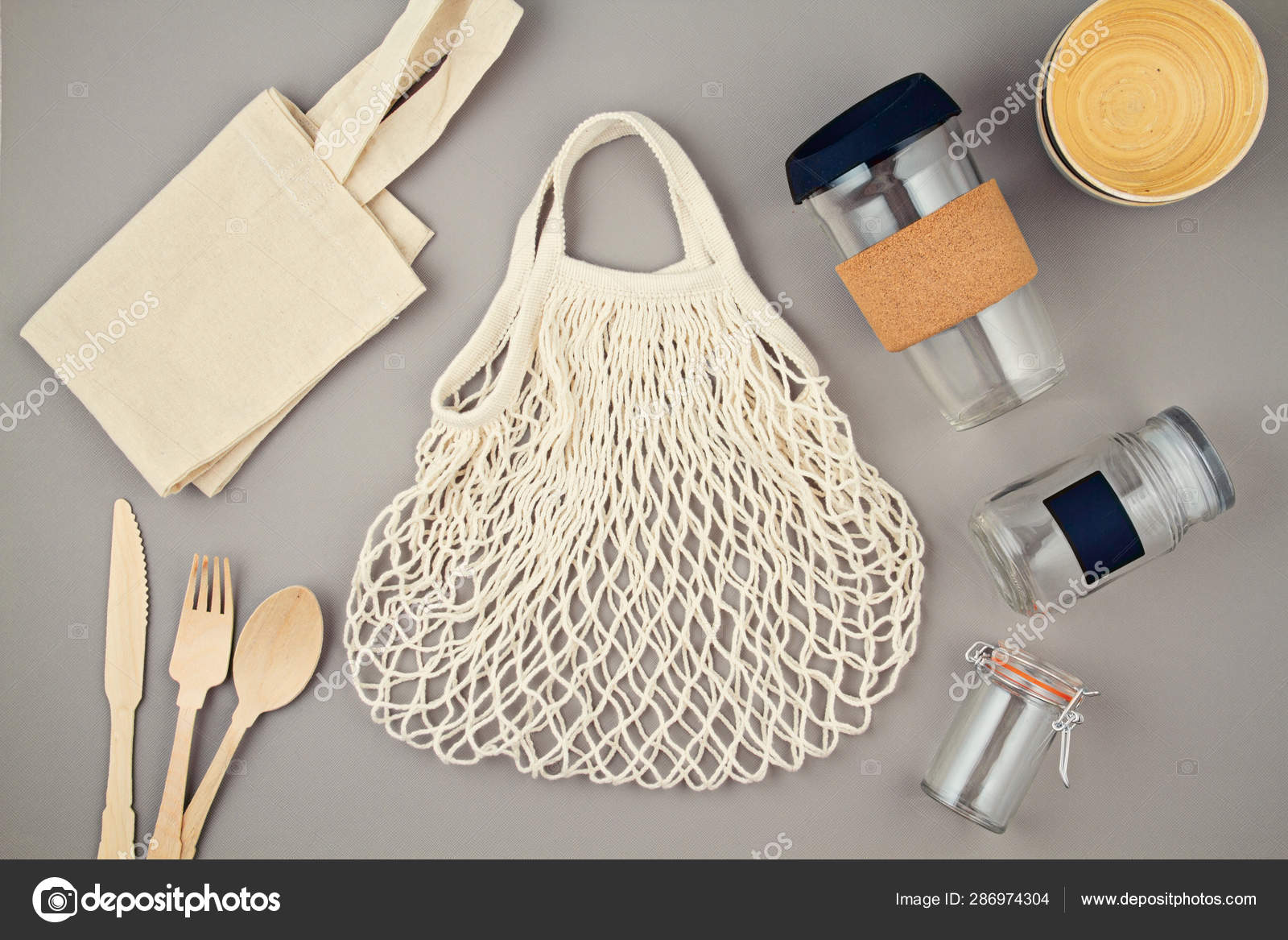 Reusable bags, glass jars and coffee mug for plastic free and zero
