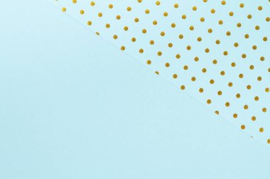 Mavi kağıt kağıtlar ve altın puantiyelerle yapılan soyut arkaplan