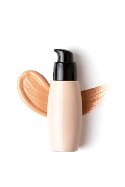 Mockup with make up face foundation bottle and smudged drop of concealer over the white background