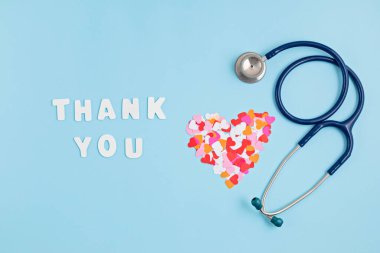 Hearts confetti and text thank you. Expressing gratitude to doctors and nurses idea clipart