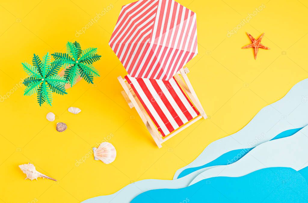 Sunbed, toy palm trees, paper sea waves. Summer vacations and beach, seaside holidays concept