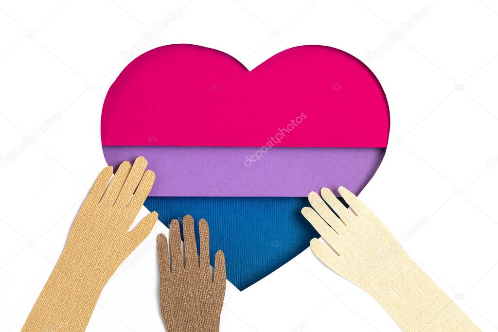 Bisexual flag in the form of paper cut out shape with blue, pink and violet colors. Love, pride, diversity, tolerance, equality idea
