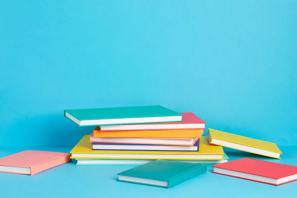 Pile of colorful books and notebooks. Education, study, learning, back to school, teaching concept