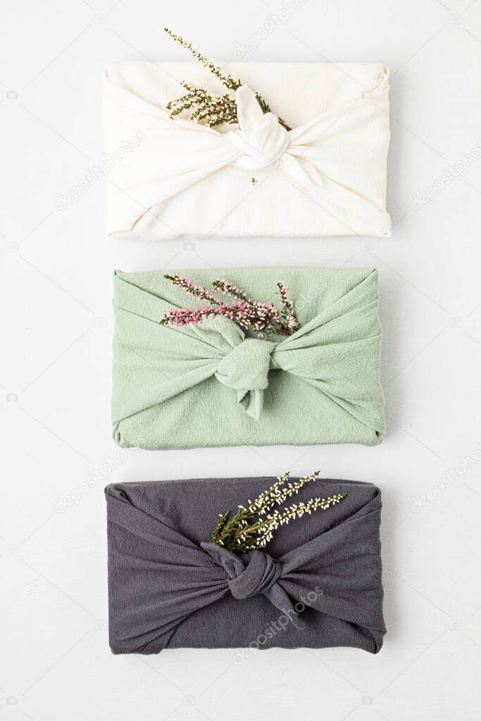 Zero waste gift wrapping traditional Japanese furoshiki style. Plastic free hand made gift package for Christmas, birthday, Easter and other occasions