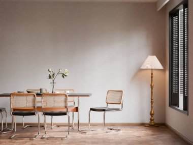 Çağdaş bir yemek odası. İçinde rattan baston arka koltuklar ve büyük boş bir duvara dayanan bir lamba var..