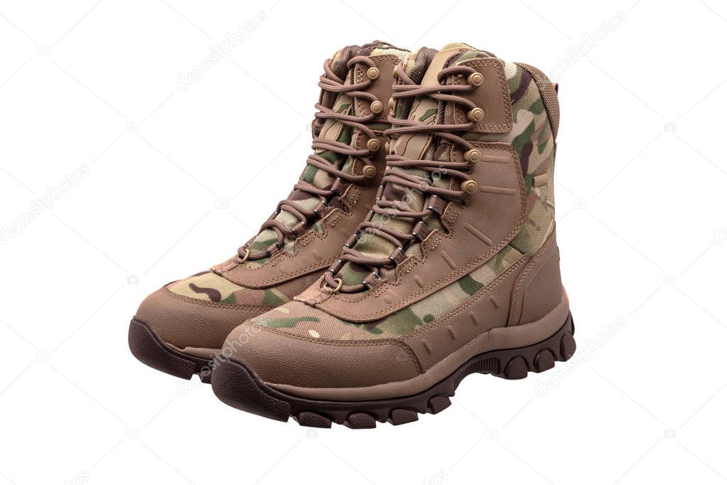 Camouflage military boots isolated on white background