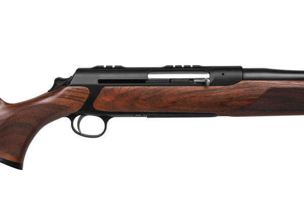 Classic semi-automatic hunting rifle with a rifled barrel and a wooden butt isolated on white background
